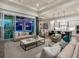 Open-concept living area connects to the kitchen and patio, creating a welcoming and spacious atmosphere at 16917 Clearlake Ave, Lakewood Ranch, FL 34202