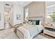 Spacious bedroom with neutral walls, modern decor, and an open floor plan at 16917 Clearlake Ave, Lakewood Ranch, FL 34202