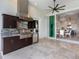 Covered patio features a functional outdoor kitchen with granite countertops and a mini fridge at 16917 Clearlake Ave, Lakewood Ranch, FL 34202