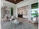 Inviting outdoor living area with views of the pool, opening to indoor dining and kitchen at 16917 Clearlake Ave, Lakewood Ranch, FL 34202