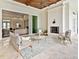 Inviting outdoor living area features a fireplace, comfortable seating, and seamless indoor-outdoor flow at 16917 Clearlake Ave, Lakewood Ranch, FL 34202