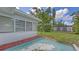 Home exterior with a spacious backyard featuring a patio and storage shed at 2088 Grove St, Sarasota, FL 34239