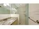 Updated bathroom featuring granite countertops, a glass enclosed shower and modern fixtures at 2088 Grove St, Sarasota, FL 34239