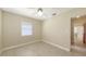 A bright bedroom filled with natural light featuring tile flooring and neutral paint at 2088 Grove St, Sarasota, FL 34239