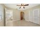 This bedroom features a tile floor, an ensuite bathroom and closet at 2088 Grove St, Sarasota, FL 34239