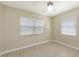 A bright bedroom filled with natural light featuring tile flooring and neutral paint at 2088 Grove St, Sarasota, FL 34239