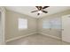 Bedroom featuring tile flooring, neutral walls, a ceiling fan, and natural light at 2088 Grove St, Sarasota, FL 34239