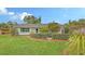 Charming home featuring lush lawn, verdant hedges, and well-maintained landscaping at 2088 Grove St, Sarasota, FL 34239