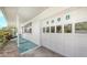 Attached white garage door displaying house numbers with adjacent covered walkway at 2088 Grove St, Sarasota, FL 34239
