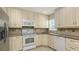 Kitchen features granite countertops, stainless steel appliances and a window at 2088 Grove St, Sarasota, FL 34239
