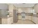 Kitchen featuring stainless appliances, tile countertops and ample cabinet space at 2088 Grove St, Sarasota, FL 34239