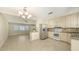 Bright kitchen featuring stainless steel appliances, tile flooring, and a decorative chandelier at 2088 Grove St, Sarasota, FL 34239