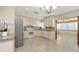 Well-lit kitchen featuring stainless steel appliances, granite counters and tile floors at 2088 Grove St, Sarasota, FL 34239
