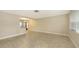 Spacious living area featuring tile flooring and seamless flow into the dining area at 2088 Grove St, Sarasota, FL 34239