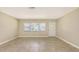 Bright and airy living room featuring tile floors, neutral paint and ample natural light at 2088 Grove St, Sarasota, FL 34239