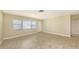 Bright living room showcasing tile floors, fresh paint, and plenty of natural light at 2088 Grove St, Sarasota, FL 34239