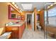 Bright bathroom featuring a double vanity, tiled floors, and a glass-enclosed shower at 2181 Harbourside Dr # 1403, Longboat Key, FL 34228