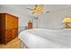 Spacious bedroom with hardwood floors, ceiling fan, and a large closet at 2181 Harbourside Dr # 1403, Longboat Key, FL 34228