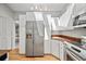 Modern kitchen with stainless steel appliances, bright white cabinets, and a convenient layout at 2181 Harbourside Dr # 1403, Longboat Key, FL 34228