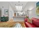 Cozy living room with skylights, comfortable seating, and an open layout flowing into the kitchen at 2181 Harbourside Dr # 1403, Longboat Key, FL 34228