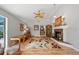 Comfortable living room with hardwood floors, a fireplace, and a view of the pool area at 2181 Harbourside Dr # 1403, Longboat Key, FL 34228