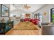 Bright living room featuring hardwood floors, a vaulted ceiling, and comfortable seating at 2181 Harbourside Dr # 1403, Longboat Key, FL 34228