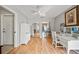 Versatile space with mirrored wall, hardwood floors, and a ceiling fan at 2181 Harbourside Dr # 1403, Longboat Key, FL 34228