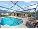 A private screened pool provides a refreshing escape with ample space for relaxation and recreation at 2181 Harbourside Dr # 1403, Longboat Key, FL 34228