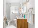 Well-lit bathroom with modern fixtures, a vintage vanity and a shower-tub combination at 2189 Hillview St, Sarasota, FL 34239