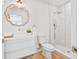 Stylish bathroom featuring a glass enclosed shower and a white vanity with decorative mirror at 2189 Hillview St, Sarasota, FL 34239
