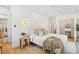 Bright bedroom featuring soft, neutral tones, natural light, and wood floors at 2189 Hillview St, Sarasota, FL 34239