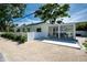 Beautiful home exterior features a private patio with a dining area perfect for outdoor entertaining and relaxation at 2189 Hillview St, Sarasota, FL 34239