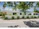 Charming single-story home featuring white exterior, a white fence, and neatly landscaped front yard at 2189 Hillview St, Sarasota, FL 34239