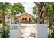 Charming home with modern address markers, a cozy porch, and a xeriscaped front yard for low maintenance at 2189 Hillview St, Sarasota, FL 34239