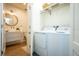 Laundry area with washer and dryer, shelving, plus half-bathroom and decorative mirror at 2189 Hillview St, Sarasota, FL 34239