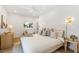 Tranquil bedroom featuring wood floors, neutral color palette, and ample natural light, creating a serene retreat at 2189 Hillview St, Sarasota, FL 34239