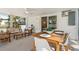 Outdoor patio with seating and dining areas, accessible from the main bedroom through sliding glass doors at 2189 Hillview St, Sarasota, FL 34239