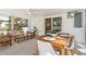 Cozy screened-in porch with dining and lounging area, perfect for relaxing and entertaining at 2189 Hillview St, Sarasota, FL 34239