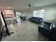 Open floor plan with a view of the kitchen, dining area, and a living room featuring luxury vinyl floors at 22214 Felton Ave, Port Charlotte, FL 33952