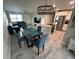 Open floor plan with a view of the kitchen, dining area, and a living room featuring luxury vinyl floors at 22214 Felton Ave, Port Charlotte, FL 33952