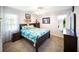 Inviting bedroom with a comfortable bed, neutral carpet, and bright natural light with coordinated furniture at 22378 Peachland Blvd, Port Charlotte, FL 33954