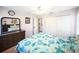 Cozy bedroom with carpet, a ceiling fan, and matching bedside tables for ample storage at 22378 Peachland Blvd, Port Charlotte, FL 33954