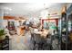 Bright dining room with seating for six, chandelier, and lots of natural light into the open plan living space at 22378 Peachland Blvd, Port Charlotte, FL 33954