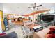 Spacious open-concept living area featuring tile flooring and a view of the modern kitchen at 22378 Peachland Blvd, Port Charlotte, FL 33954