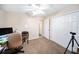 Functional office space with a desk, chair, and carpet flooring for comfort and practicality at 22378 Peachland Blvd, Port Charlotte, FL 33954