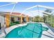 Beautiful screened-in pool area with outdoor lounge chairs and direct access to the home's vibrant living spaces at 22378 Peachland Blvd, Port Charlotte, FL 33954