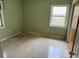 Modest bedroom with neutral walls, a window, and a door leading to the hallway at 2451 Loma Linda St, Sarasota, FL 34239