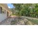 Expansive backyard featuring a mix of stone and brick patio surrounded by lush landscaping at 2462 Hyde Park St, Sarasota, FL 34239
