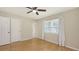 Bedroom featuring hardwood floors, natural light from the window, and two closets at 2462 Hyde Park St, Sarasota, FL 34239