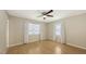 Bright bedroom with hardwood floors, a ceiling fan and two windows at 2462 Hyde Park St, Sarasota, FL 34239